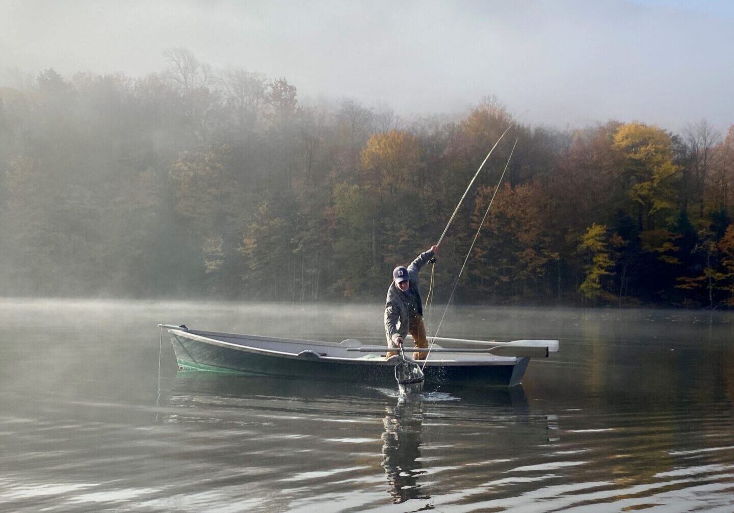 A man on a surfboard in the water.